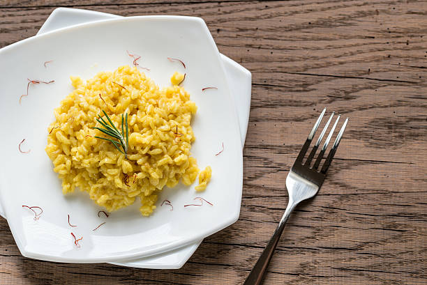 Risotto with saffron Risotto with saffron pistil stock pictures, royalty-free photos & images