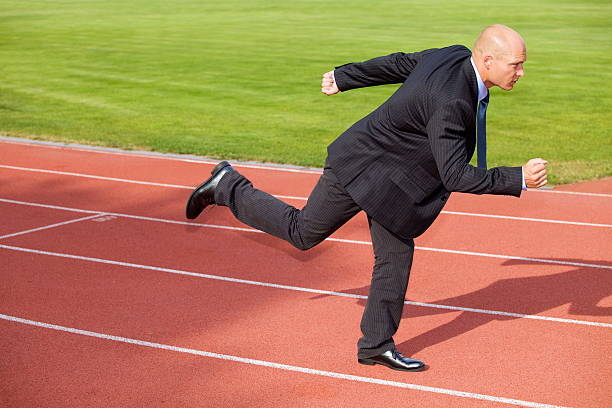 istock Businessman running on race track 470509370