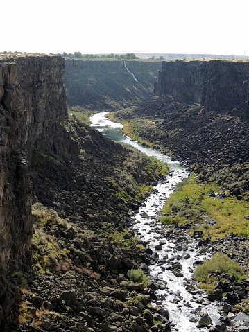 The Malad River Canyon is 250 feet deep and 2.5 miles long and the river empties nto the Snake River.