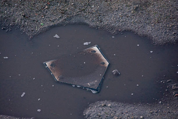 Home plate is flooded after a summer rainstorm.