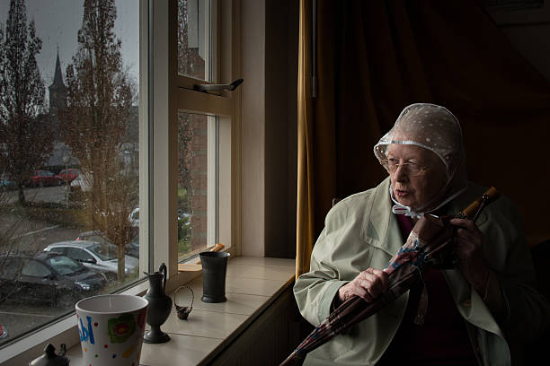 Senior woman producing a textile product at home
