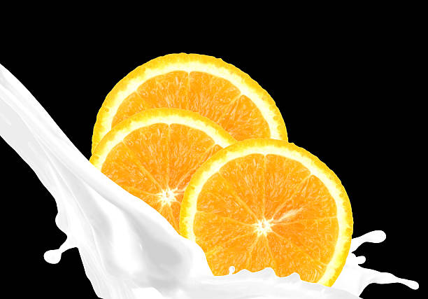 Splashing milk with orange