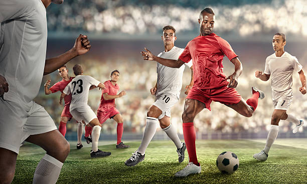 istock Soccer player kicking ball in stadium 470518454