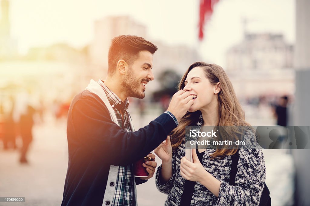 Young couple in the city eating chestnuts Young people eating chestnuts in Istanbul Eating Stock Photo