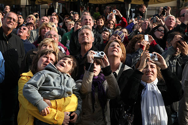 Prague, Czech Republic - October 11, 2012: Tourists look at the Prague Astronomical Clock at Old Town Square in Prague, Czech Republic.