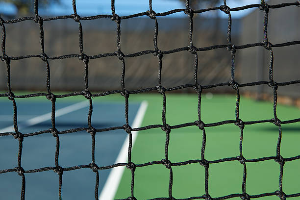istock Tennis Net with the Court Beyond 470519863