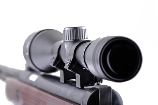 Rifle closeup on a white background with a telescopic sight