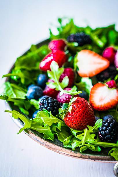 istock Green salad with arugula and berries 470520618