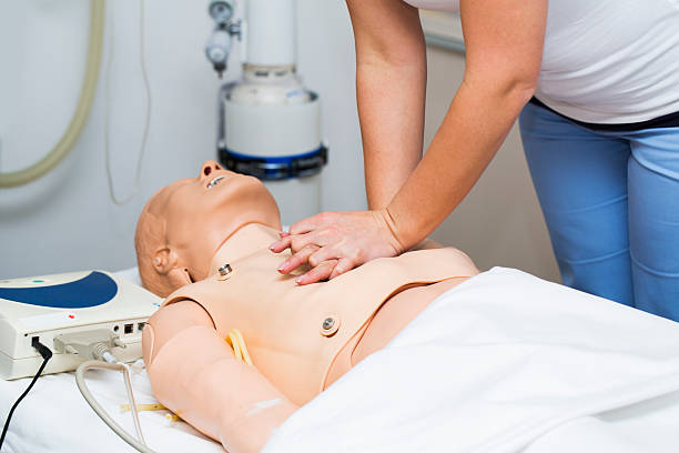 istock CPR seminar,nurse performing heart massage of dummy 470523504