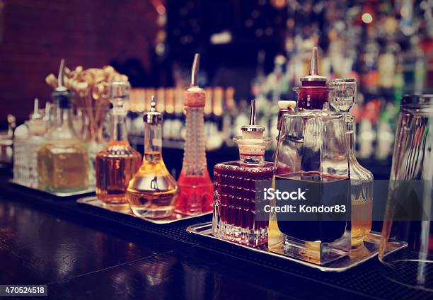 Closeup Of A Variety Of Liquor In Glass Bottles On Counter Stockfoto en meer beelden van Bar - Gebouw