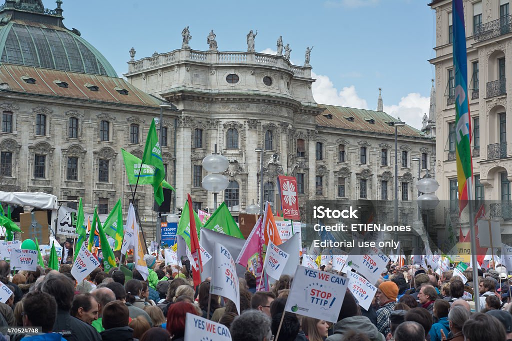 Anti TTIP Protest in Munich Germany Munich, Germany – April 18, 2015:  Protesters turn out in force to protest TTIP trade deal, the Transatlantic Trade and Investment Partnership, in Munich Germany. 2015 Stock Photo