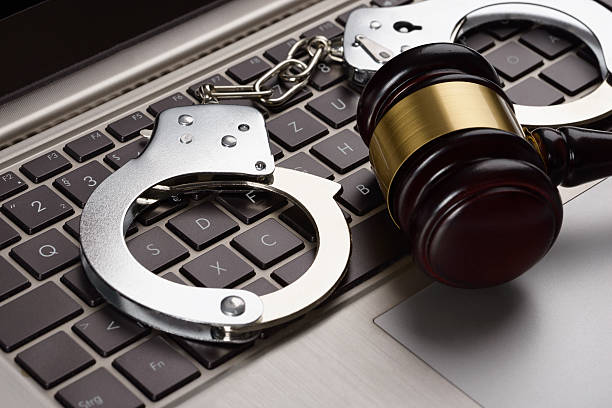 istock Gavel And Handcuffs On Laptop 470525050