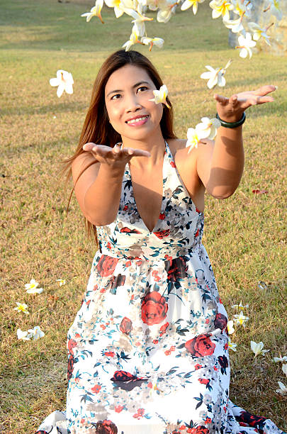 istock Woman flow white flowers 470525519