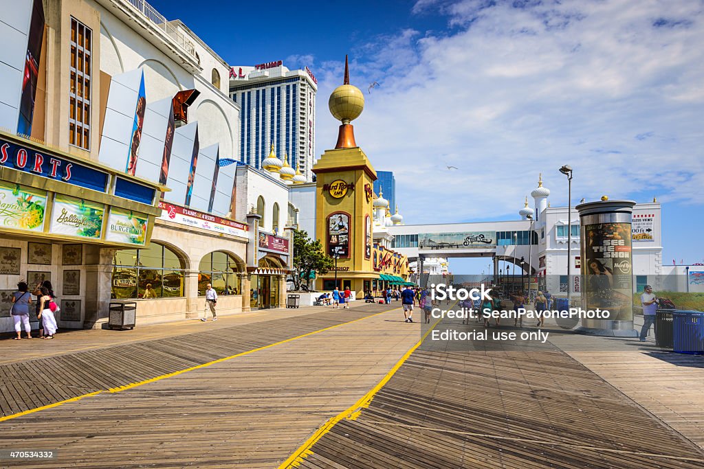 Atlantic City on the Boardwalk Atlantic City, New Jersey, USA - September 8, 2012: Tourists walk on the boardwalk in Atlantic City. The city is popular for the numerous gambling resorts located there. Atlantic City Stock Photo
