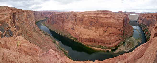 Panoramic view of red rock Glen Canyon, Colorado river and Glen Canyon Dam in background