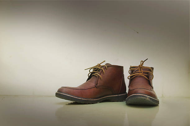 istock Pair of old brown working boots 470534914