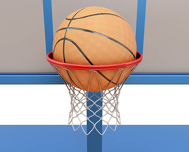 istock Basketball ball falling into a ring close-up 470535180