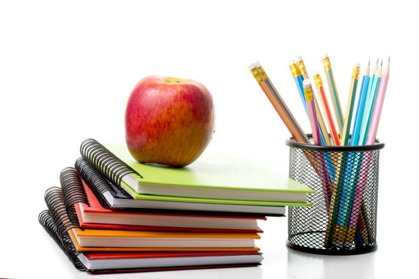 istock Apple on top colorful books isolated 470535368