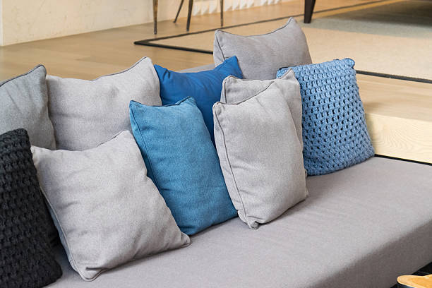 istock row of pillows on sofa in living room 470535714