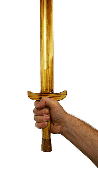 istock Hand Gripping a Wooden Medieval Practice Sword 470538496