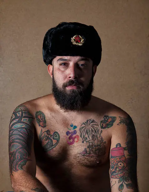 Tattooed Man Wearing Soviet Fur Hat