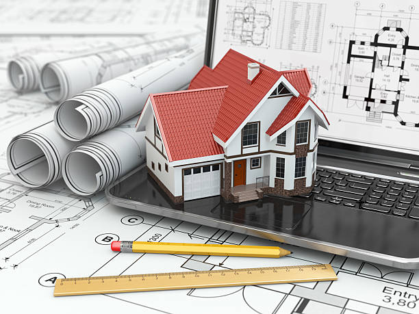 istock Laptop, house and blueprint with project. 470549363