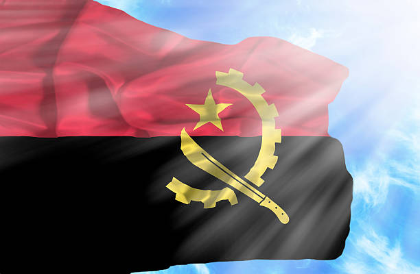 istock Angola waving flag against blue sky with sunrays 470552729