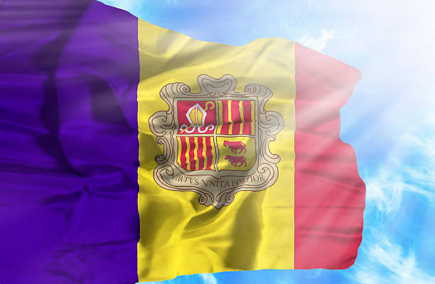 istock Andorra waving flag against blue sky with sunrays 470552749