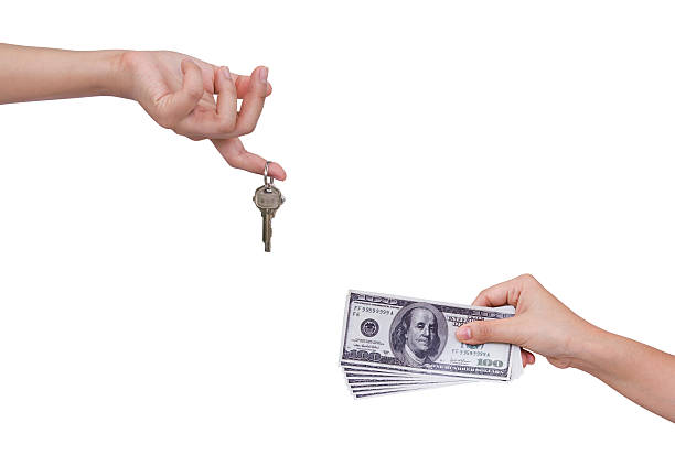 istock Human hand hold money and keys 470553857