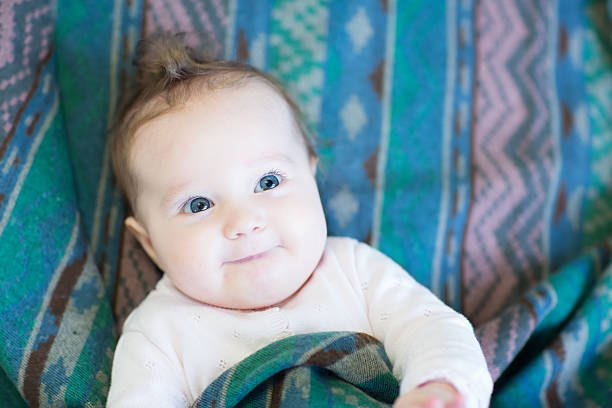 istock Curious little baby in a warm green blanket 470554109
