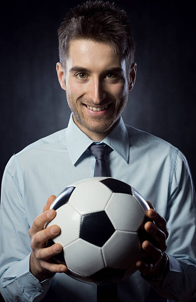 istock Businessman with soccer ball 470556179