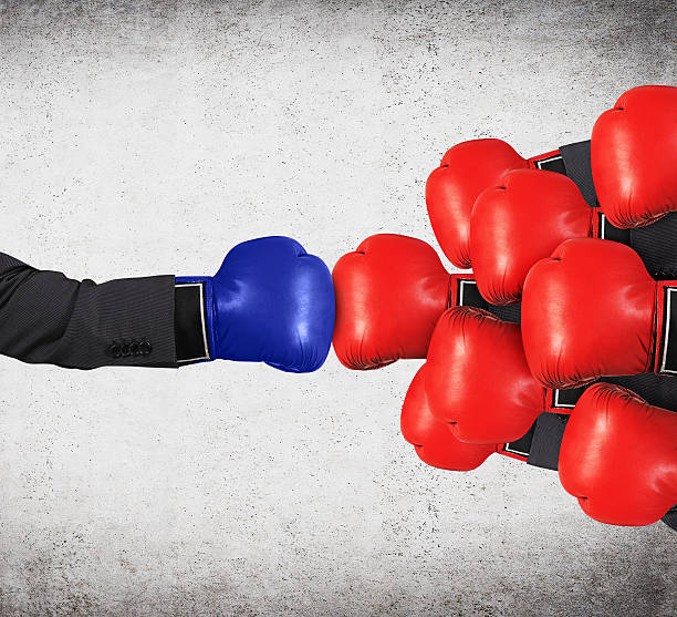istock hands in red and blue gloves 470556796