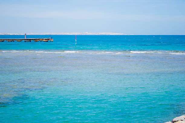 идиллический пляж, море - pattern blue sea sand стоковые фото и изображения