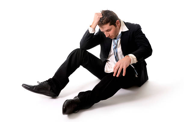 istock Young Business Man in Stress on the floor 470563625