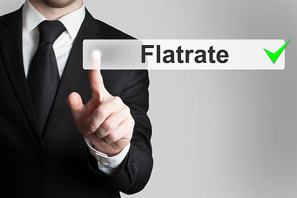 uomo d'affari spingendo il pulsante flatrate - uptime foto e immagini stock