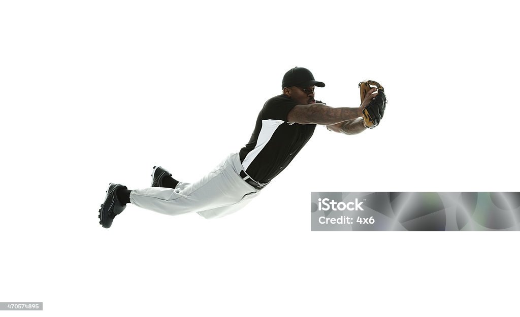 Joueur de Baseball de saut - Photo de Adulte libre de droits