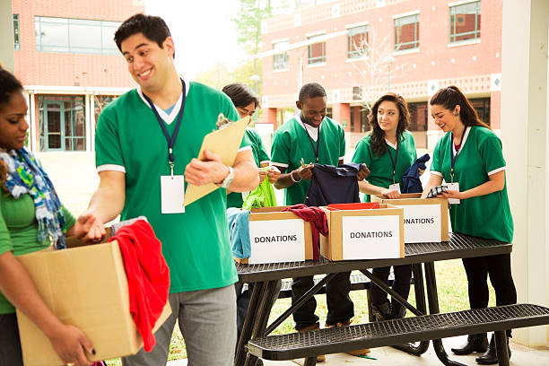 istock Volunteers: College students collect clothing donations for needy. 470576373