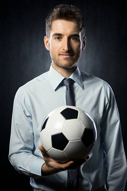 istock Businessman with soccer ball 470580965