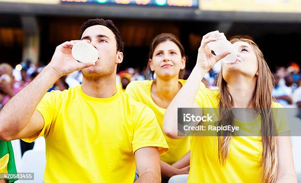 Soccer Fans Refresh Themselves After Cheering On The Brazilian Team Stock Photo - Download Image Now