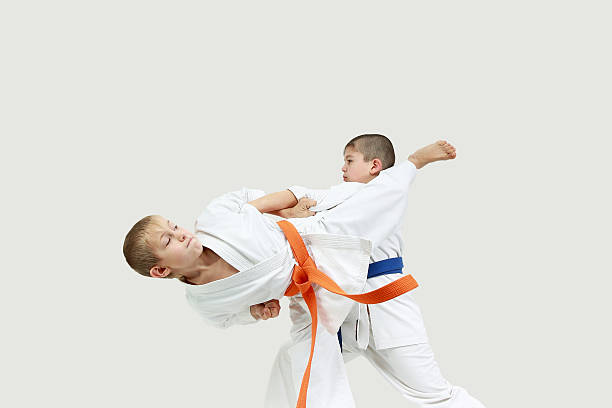 istock Boys in karategi are doing paired exercises karate 470586086
