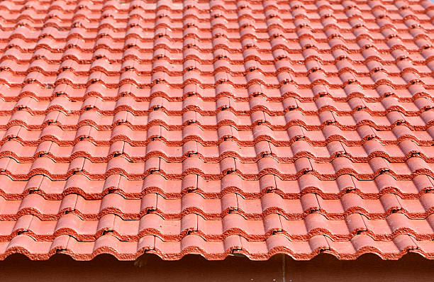 istock roof under construction with stacks of tiles for home build 470590247