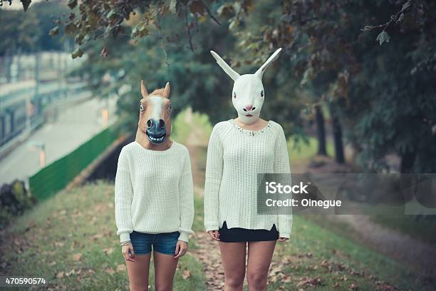 Horse And Rabbit Mask Young Couple Beautiful Women Girls Stock Photo - Download Image Now