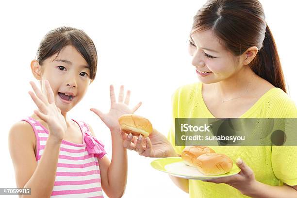 Mother And Child Eating Food Together Stock Photo - Download Image Now - Adult, Beautiful People, Beautiful Woman