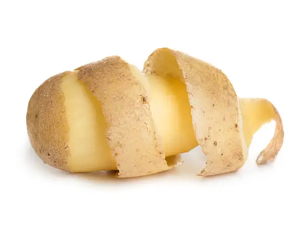 Photo of Close-up of a peeled potato isolated on a white background