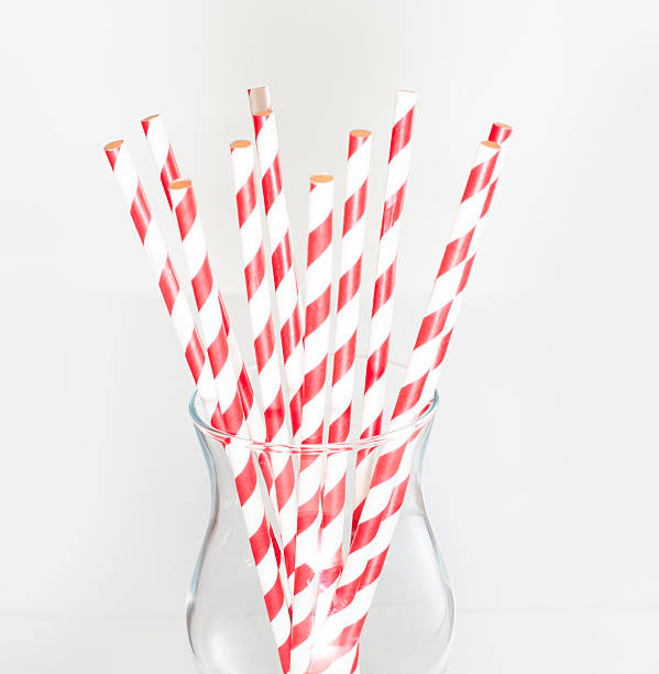 istock Stripped paper drink straws in glass 470601677