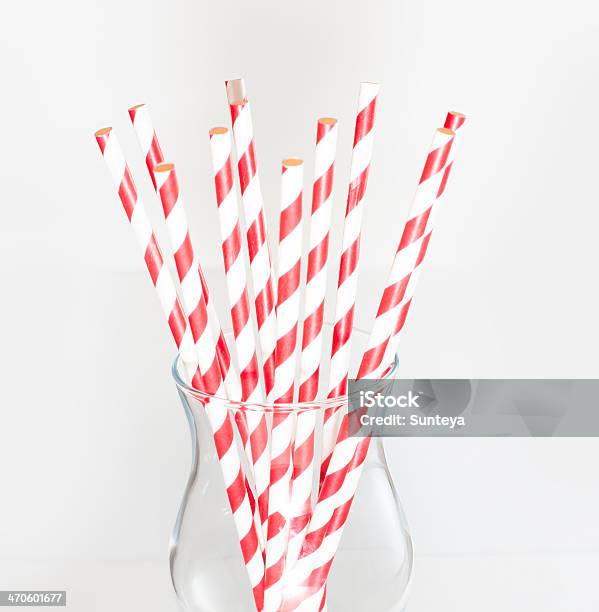 Stripped Paper Drink Straws In Glass Stock Photo - Download Image Now - Paper Straw, White Background, Abstract