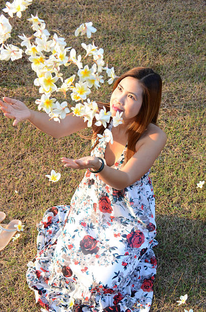 istock Woman flow white flowers 470602311