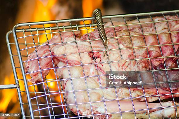 Grill With Meat For Barbecue Fire In Background Stock Photo - Download Image Now - 2015, American Culture, Animal