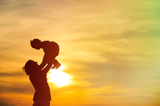 istock father and little daughter playing at sunset 470603530