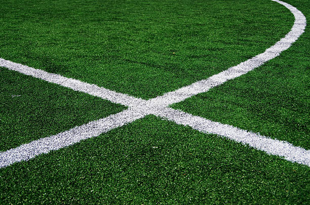 istock White abstract lines on a green football field. 470606646
